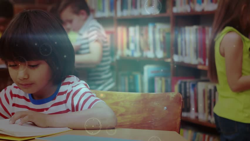 Boy studying turning pages in library while HUD overlay highlighting peers and shelves. Kids, education, learning, literacy, library, technology, classroom