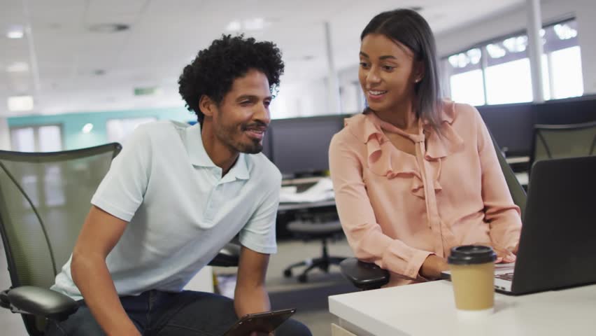 Man using smartphone rotating digital globe as woman watching for business data visualization. Collaboration, teamwork, innovation, technology, analytics, professional, modern - Powered by Shutterstock - Get 15% off with code: PIKWIZARD15