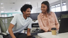 Man using smartphone rotating digital globe as woman watching for business data visualization. Collaboration, teamwork, innovation, technology, analytics, professional, modern - Powered by Shutterstock - Get 15% off with code: PIKWIZARD15