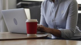 mid-adult woman typing on laptop, generating notification bubbles signaling social media growth. Productivity, technology, communication, digital, modern, workspace, focus - Powered by Shutterstock - Get 15% off with code: PIKWIZARD15