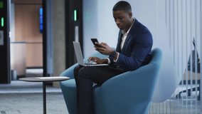 Marketer using laptop and scrolling phone, tracking engagement as notification counters rising. Technology, communication, digital, workspace, innovation, connectivity, professional - Powered by Shutterstock - Get 15% off with code: PIKWIZARD15