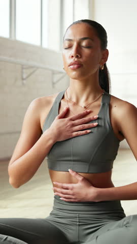 Yoga, calm and woman with heart health, breathing and balance with wellness, meditation and zen. Yogi, stress relief and person in studio, holistic healing or pilates with fitness or spiritual energy