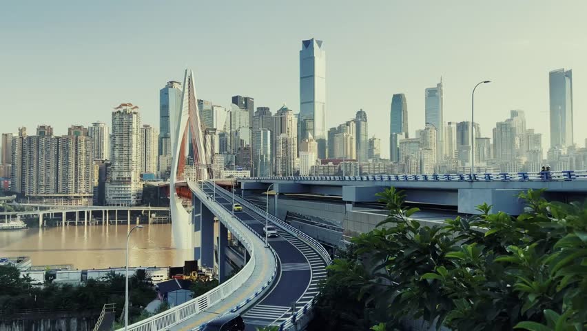 Modern skyscraper building in downtown Chongqing, China, surrounded by high-rise architecture, urban skyline, and the dynamic atmosphere of the city.