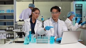 Scientists conducting research in a biotechnology lab, using pipettes and test tubes for medical and chemical experiments. Innovation in chemistry, healthcare, and medicine. - Powered by Shutterstock - Get 15% off with code: PIKWIZARD15