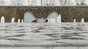 Decorative fountain with mosaic wall and sculptural insets
Multiple water jets rise from a foreground fountain against a circular‑tiled brown and gold mosaic wall featuring two large white curved inse - Powered by Shutterstock - Get 15% off with code: PIKWIZARD15