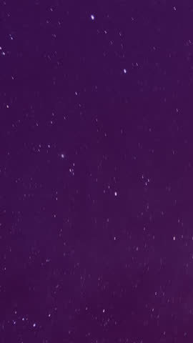 Time‑lapse of the Milky Way and moonrise over a majestic mountain landscape at night, revealing stars, galaxies and shifting light in a tranquil, awe‑inspiring natural scene.