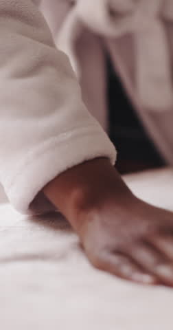 Hand, bedroom and woman with blanket, cleaning and chore with mattress, comfort and calm. Person, apartment and home with sheets, bedding duvet and organized with daily routine, tidy and morning