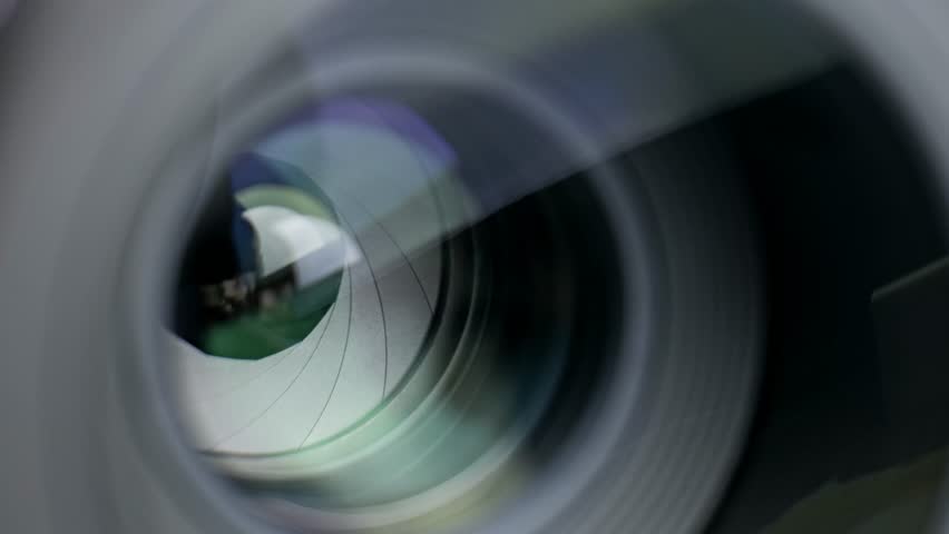 Controlling aperture and depth of field in camera lens