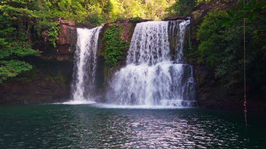 Beautiful waterfall in tropical rainforest jungle on nature background 4K