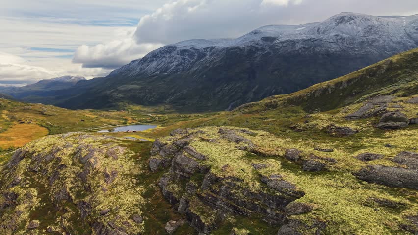 Breathtaking landscapes of Jotunheimen National Park showcasing stunning mountains, crystal-clear lakes, and vibrant greenery in Norway