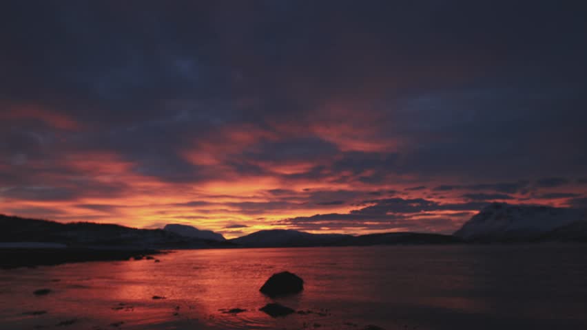 Timelapse captures a vivid Arctic sunset beyond the Arctic Circle in Northern Norway
