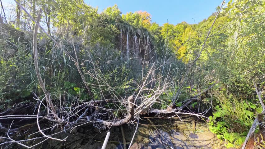 Establishing, crane  shot of a wonderful water cascades in the Plitvice Lakes National Park in Croatia