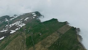 Seceda summit area and descending alpine grasslands, aerial view. Misty Dolomites panorama in South Tyrol under overcast weather - Powered by Shutterstock - Get 15% off with code: PIKWIZARD15