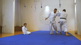 Athletes in kimonos practice martial arts - Powered by Shutterstock - Get 15% off with code: PIKWIZARD15