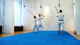 Athletes in kimonos practice martial arts - Powered by Shutterstock - Get 15% off with code: PIKWIZARD15