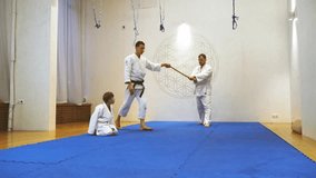 Athletes in kimonos practice martial arts - Powered by Shutterstock - Get 15% off with code: PIKWIZARD15