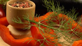 Fresh vegetables for a vegetable dish. Tomato, bell pepper, onion, eggplant, dill, and spices on a wooden board, side view - Powered by Shutterstock - Get 15% off with code: PIKWIZARD15