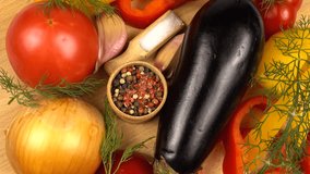 Fresh vegetables for a vegetable dish. Tomato, bell pepper, onion, eggplant, dill, and spices on a wooden board, top view - Powered by Shutterstock - Get 15% off with code: PIKWIZARD15