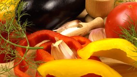 Fresh vegetables for a vegetable dish. Tomato, bell pepper, onion, eggplant, dill, and spices on a wooden board, side view - Powered by Shutterstock - Get 15% off with code: PIKWIZARD15