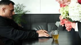 Startup founder working remotely from cozy home office with tea mug. Modern interior, focused workflow, relaxed vibe. Perfect for productivity, tech lifestyle, or remote startup footage. - Powered by Shutterstock - Get 15% off with code: PIKWIZARD15