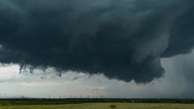 Menacing Dark Clouds Rotating With Anticyclonic Wall Cloud - real footage, long duration, cinematic 4K - Powered by Shutterstock - Get 15% off with code: PIKWIZARD15
