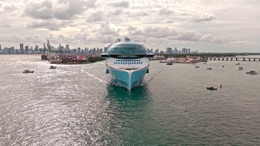 Cruise ship voyage. Aerial view of cruise in summer vacation. Cruise ship tour and travel at sea. Aerial view of luxury liner voyage. Ship leaving Miami beach port. Miami tour