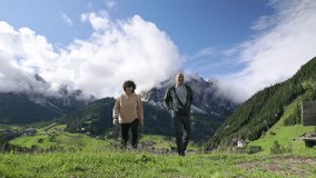 Senior couple standing together outdoors enjoying view of the Dolomites - Powered by Shutterstock - Get 15% off with code: PIKWIZARD15