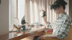 A person wearing a virtual reality headset interacts with robotic components on a desk, showcasing the fusion of technology and innovation in robotics and virtual reality. - Powered by Shutterstock - Get 15% off with code: PIKWIZARD15