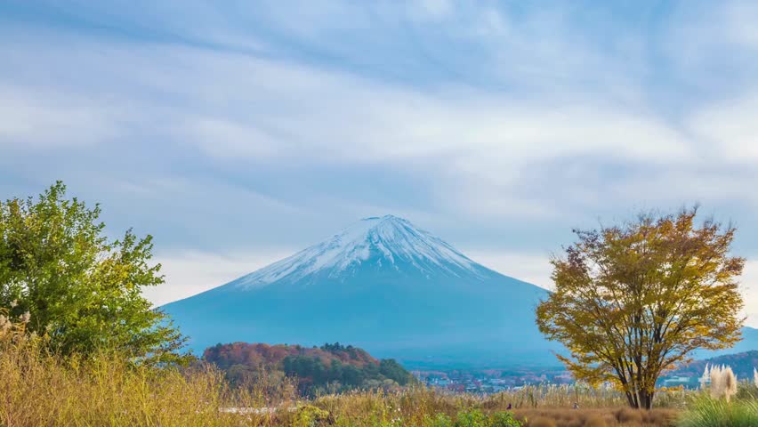 Breathtaking view of Mount Fuji surrounded by colorful autumn foliage. This serene landscape showcases Japan