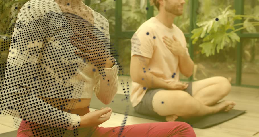Yoga duo placing hands on chest abdomen doing healthy breathing with globe code overlay in sunroom. Mindfulness, meditation, wellness, nature, digital, relaxation, harmony