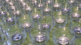 Cinematic Background of Hundreds of Burning Candles in Glass Cups Creating Warm Glow and Mesmerizing Reflections. Artistic Footage of Sea of Candle Flames Flickering Gently. Meditation Spiritual Scene - Powered by Shutterstock - Get 15% off with code: PIKWIZARD15