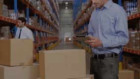 Warehouse supervisor generating supply chain network by scrolling handheld device for monitoring. Logistics, digital, connectivity, industrial, teamwork, innovation, automation - Powered by Shutterstock - Get 15% off with code: PIKWIZARD15