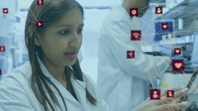 Mid adult scientist studying tablet and forming network diagram for lab review by colleague. Research, innovation, technology, collaboration, science, digital, professional - Powered by Shutterstock - Get 15% off with code: PIKWIZARD15