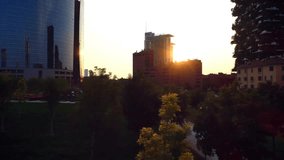 Sunset glow sparking translucent network appearing above park, pulsing icons showing connectivity. Urban, technology, connectivity, efficiency, modernity, digital, inspiration - Powered by Shutterstock - Get 15% off with code: PIKWIZARD15