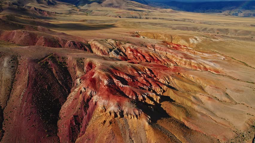 Colorful hills under stormy sky in dramatic desert landscape, Mars field Altay Russia, beautiful nature reserve.
