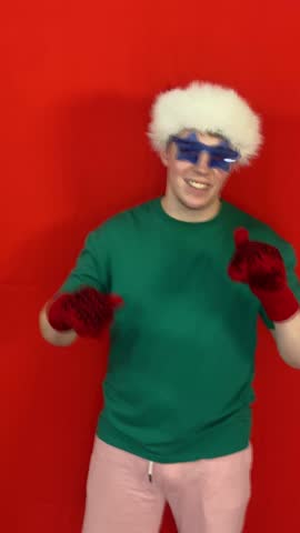 Christmas spirit. A young attractive guy in a Santa Claus hat.