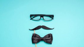 Creative flatlay overhead top view retro stylish black paper photo booth props moustaches turquoise background copy space. Men health awareness month fathers day masculinity concept blog social media - Powered by Shutterstock - Get 15% off with code: PIKWIZARD15