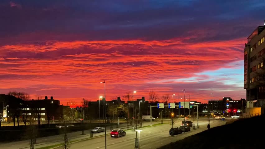 Sunset red clouds time lapse video in Pasila, city of Helsinki. 