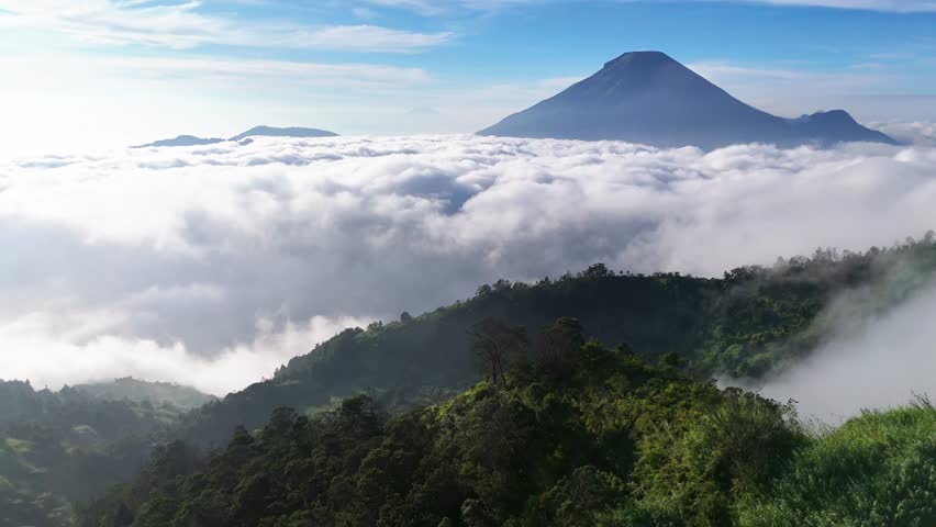 Spectacular Sea of Clouds, Volcano and Misty Highland Village in Indonesia