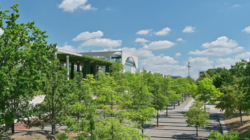 unny Summer Day in Berlin, Germany – View of the Federal Chancellery (Bundeskanzleramt) with TV Tower in the Background