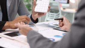 Business team meeting, discussing and analyzing financial charts and reports using documents to plan investment strategy. - Powered by Shutterstock - Get 15% off with code: PIKWIZARD15