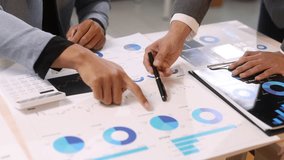 Business team meeting, discussing and analyzing financial charts and reports using documents to plan investment strategy. - Powered by Shutterstock - Get 15% off with code: PIKWIZARD15