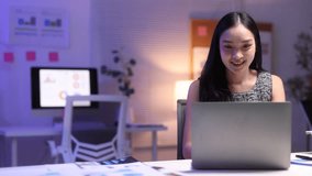 Asian businesswoman working late at night in office using laptop. - Powered by Shutterstock - Get 15% off with code: PIKWIZARD15
