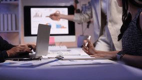 Business team discussing data analysis in office. Office workers reviewing marketing data on a computer screen, collaborating on a project late into the night. - Powered by Shutterstock - Get 15% off with code: PIKWIZARD15