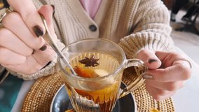 tea; herbal; hot; steam; brewing; cozy; drink; warm; lifestyle; lemon; cinnamon; sweater; spice; anise; beverage; spoon; stirring; warming; comfort; winter; autumn; hands; mug; glass; aroma; ginger; f - Powered by Shutterstock - Get 15% off with code: PIKWIZARD15