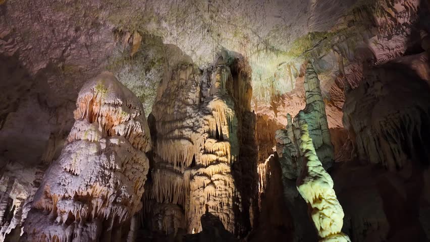 Impressive stalactite and stalagmite formations inside the caves of Postojna, Slovenia.