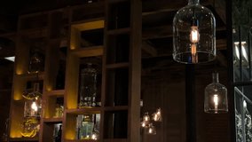 Warm interior with stylish hanging glass lamps and cozy ambient lighting in a modern restaurant or bar.  - Powered by Shutterstock - Get 15% off with code: PIKWIZARD15