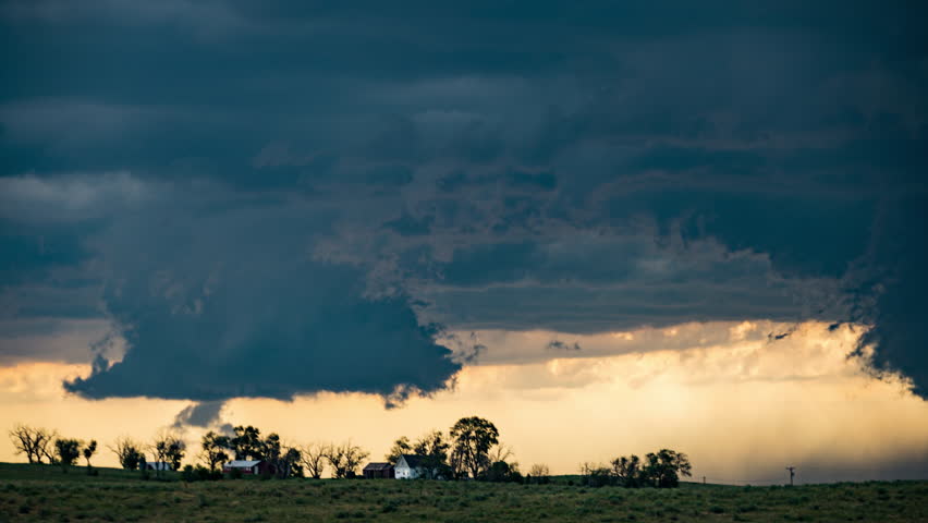 Dramatic Scary Wall Cloud Funnel Clouds Rotating Over Farm House - real footage, long duration, cinematic 4K
