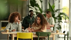 Young diverse students collaborating on a school project, sharing ideas and brainstorming together in a modern library or a creative space - Powered by Shutterstock - Get 15% off with code: PIKWIZARD15