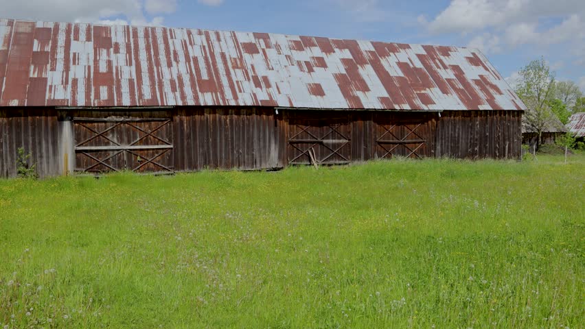 4k video of old wooden barn on polish countryside, Mazowsze region of Poland